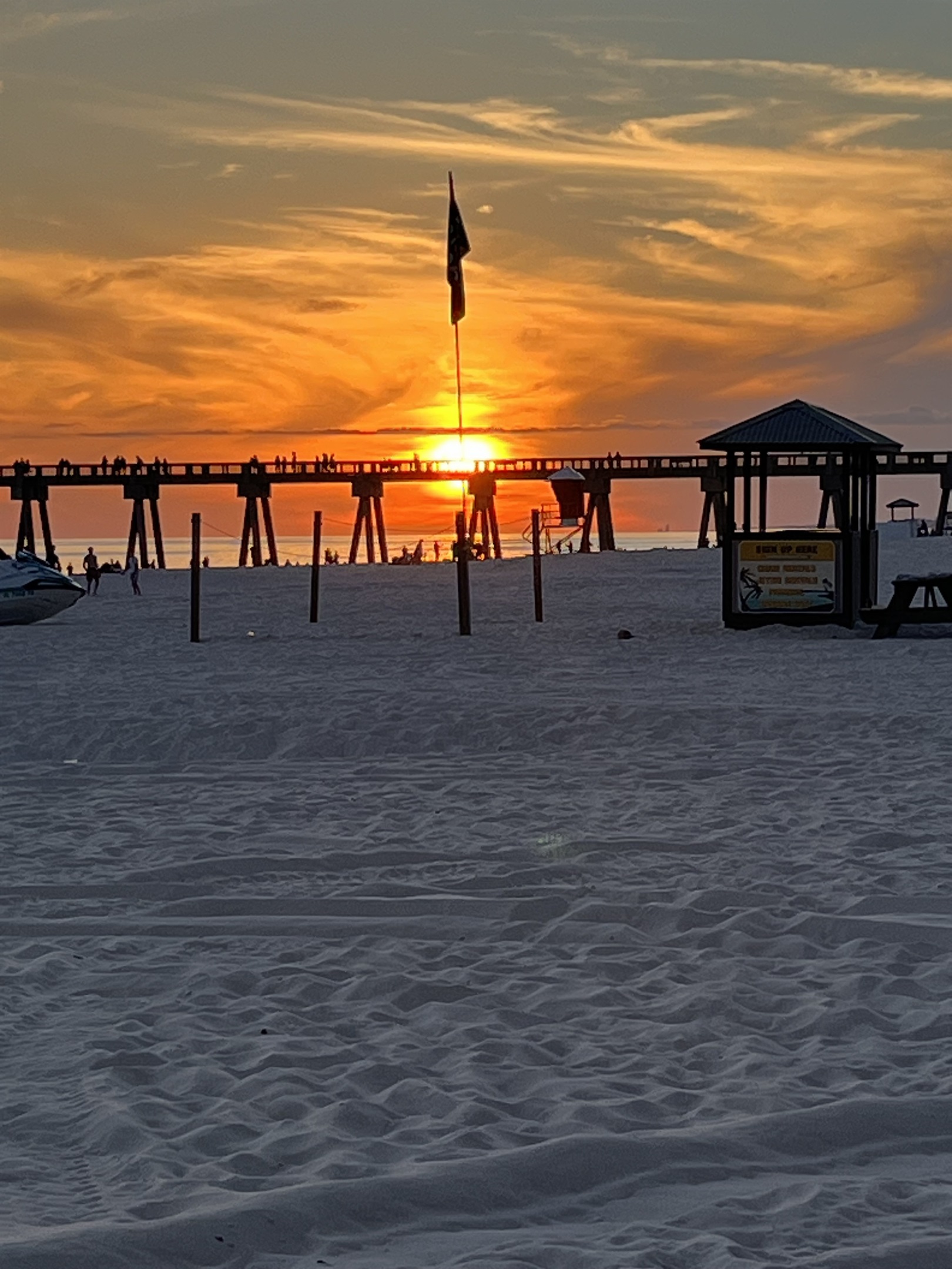 Watch the sky change colors over the Gulf as the resort lights up for the evening.