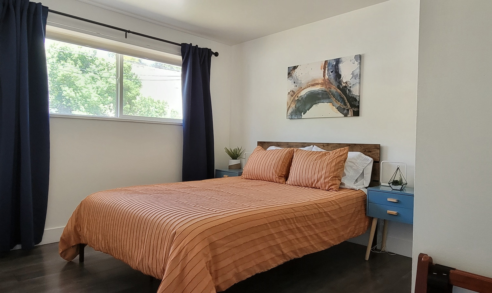The second bedroom has a queen bed.