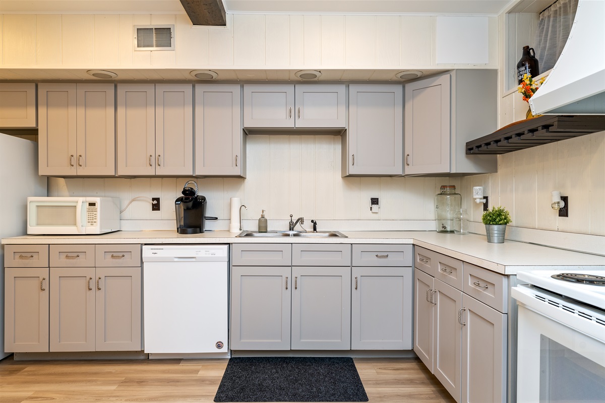 Whip up meals with ease in the spacious, full basement kitchen featuring modern appliances and plenty of counter space.