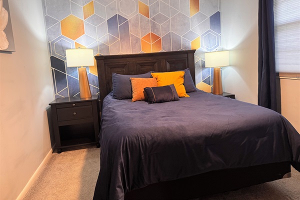 Bedroom 2 features USB charging ports, 50” smart tv, mirror, closet with hangers