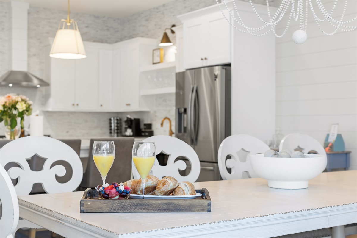 Plenty of dining room between the dining room, island, sofa table and outdoor seating