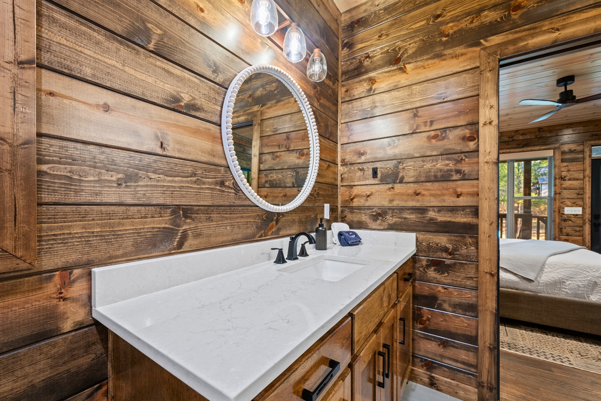 A closer look at the vanity shows off the warm finishes and thoughtful touches that make the space feel homey and well put together.