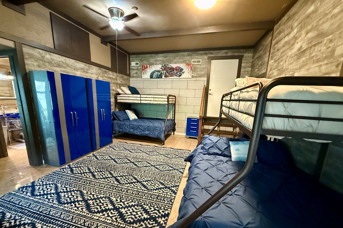 The kids will love it and the adults will appreciate it — two bunk beds with full-size bottoms and twin tops make this the perfect room for younger guests, with direct beach access just outside the sliding door downstairs.