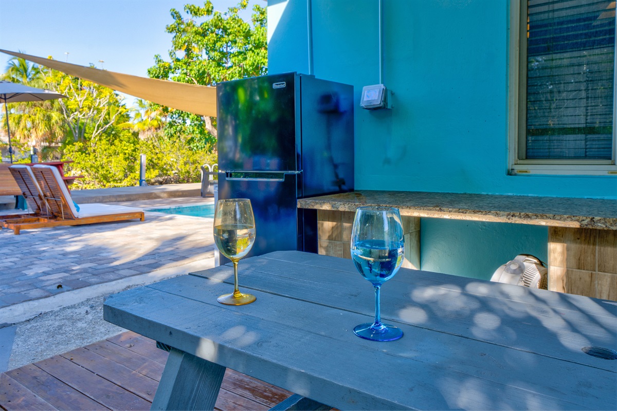 Eat and cook in the outdoor kitchen and dining area.