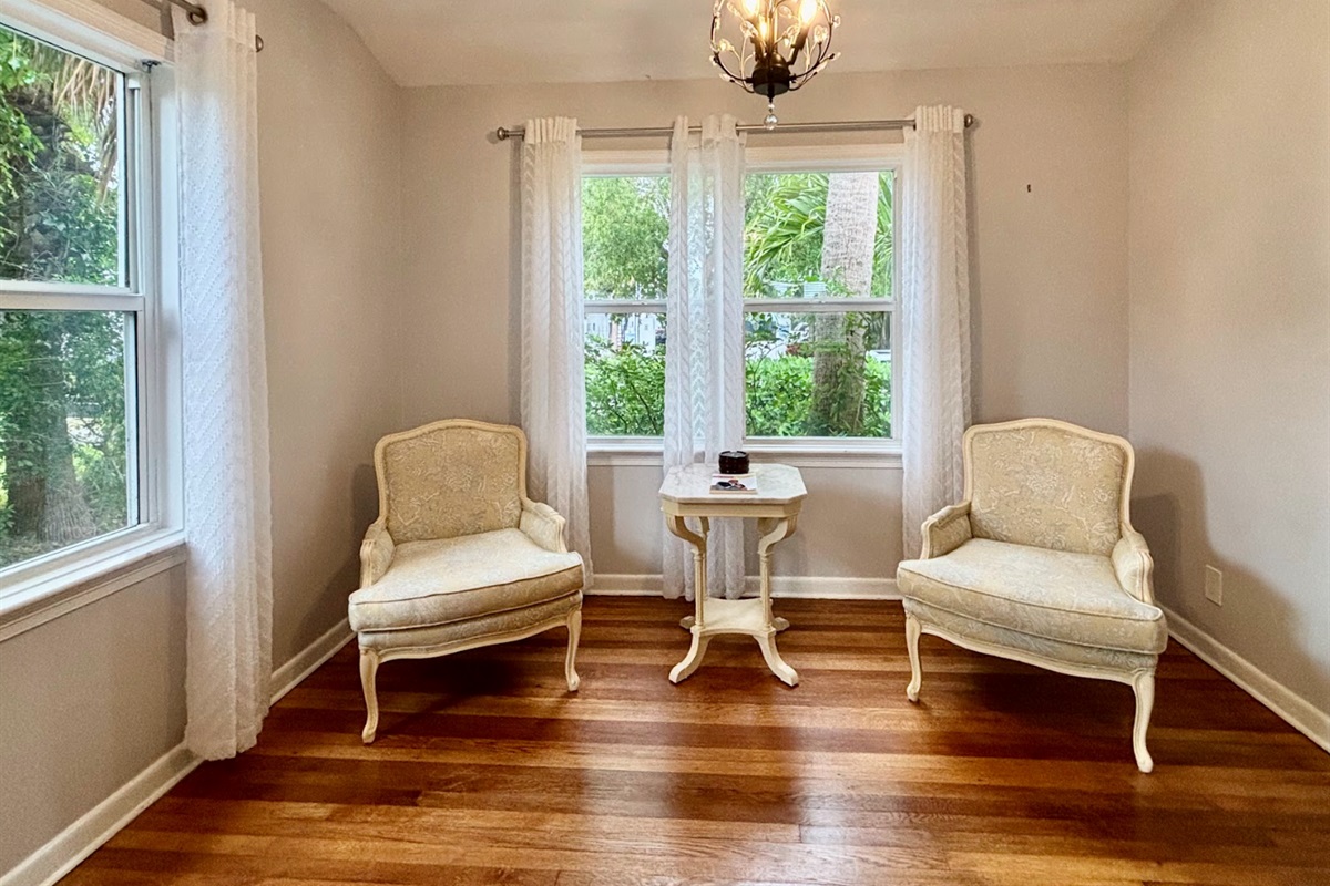 The sitting area off the main kitchen is cozy and well-lit, a wonderful little nook to relax in.