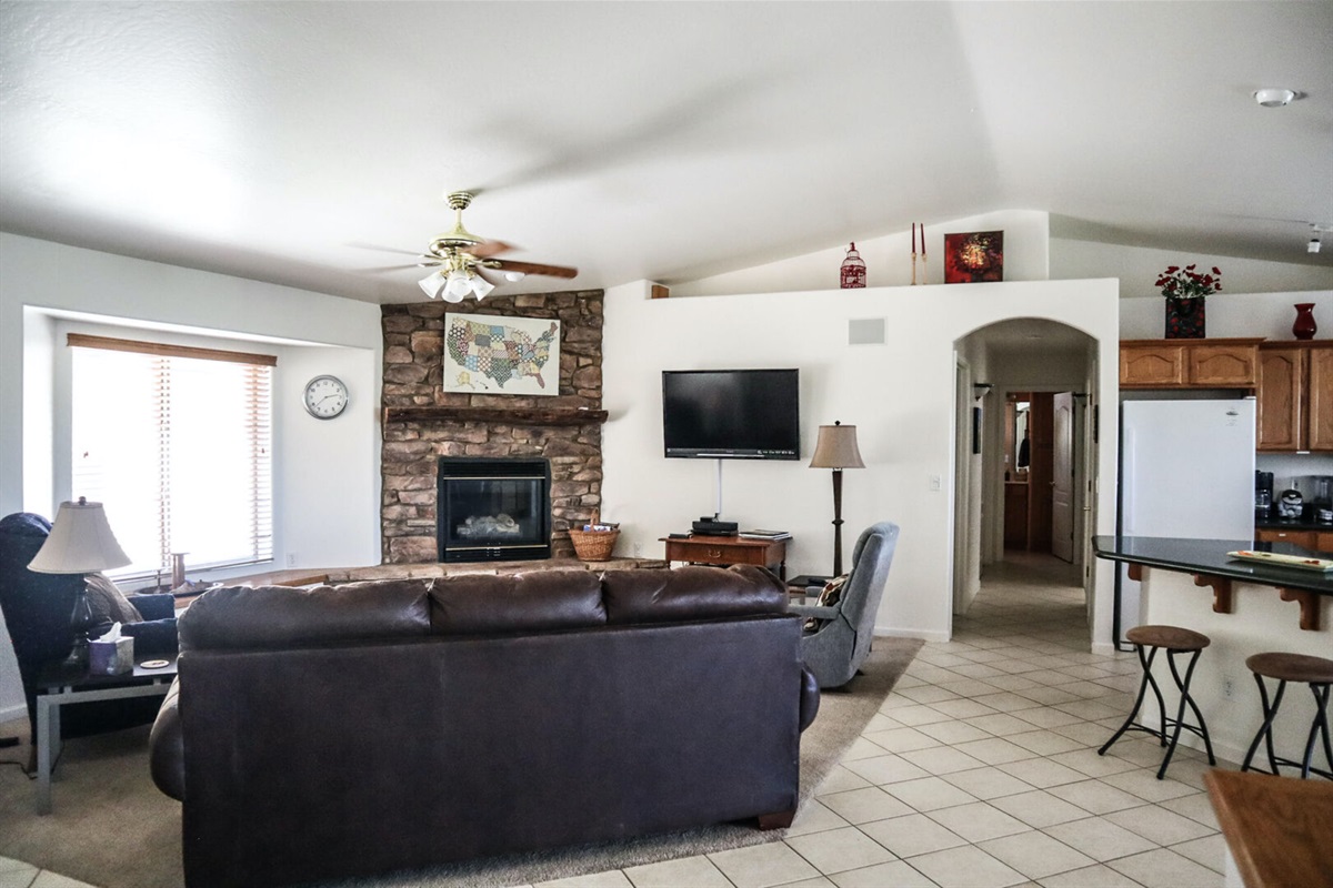 Enter into a spacious open floor plan with plenty of seating for everyone.