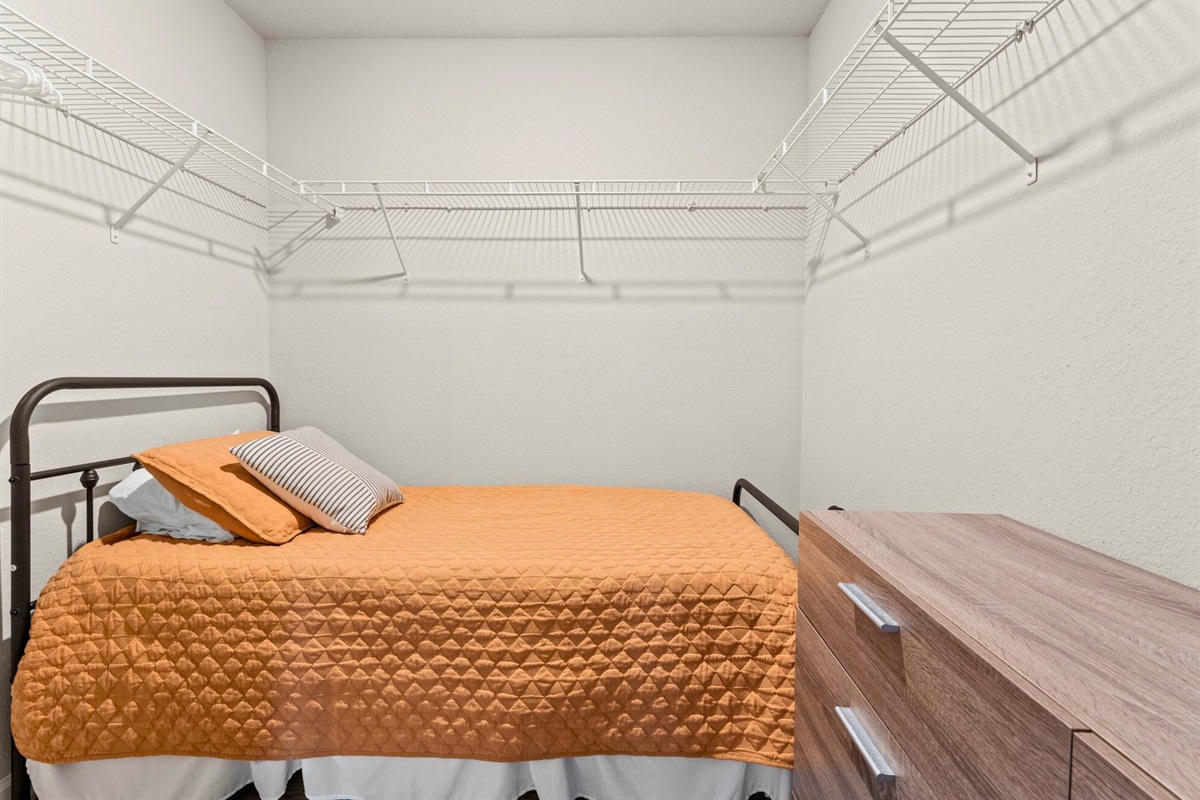 This twin nook space is a fun and practical option for kids or extra guests, offering a comfortable setup that makes sharing easy and enjoyable.