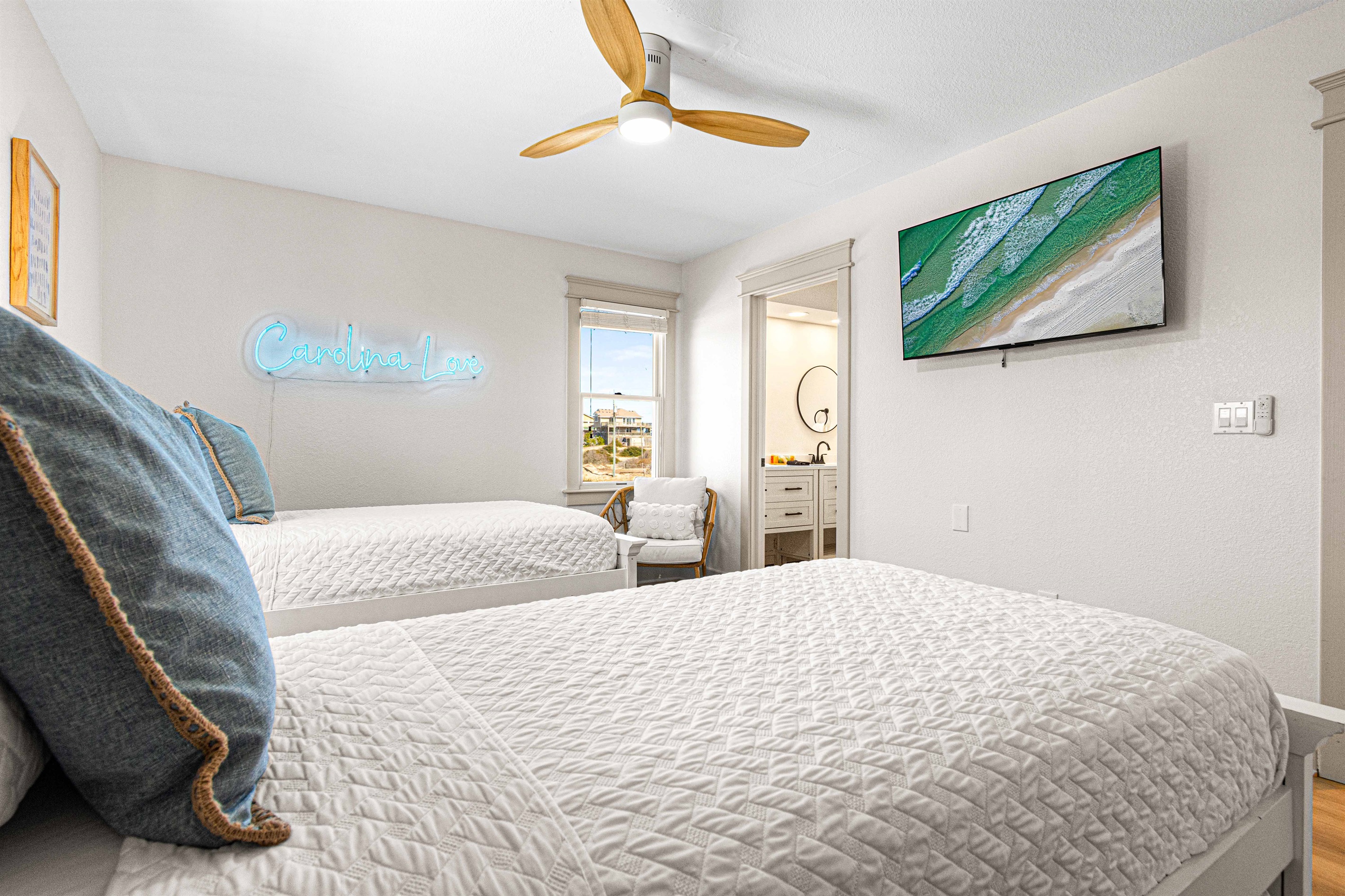 Two twin beds and a 50" smart tv