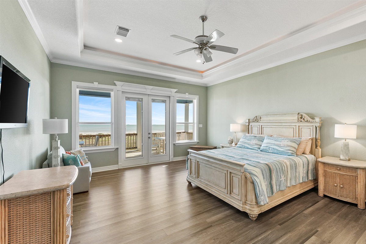 Unwind in the master bedroom - with a plush king bed and direct access to the wraparound deck.