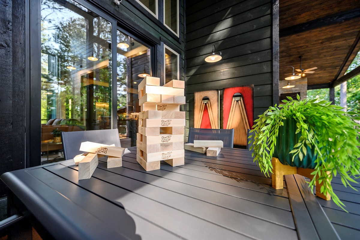 Outdoor dining space with fun games and cozy vibes