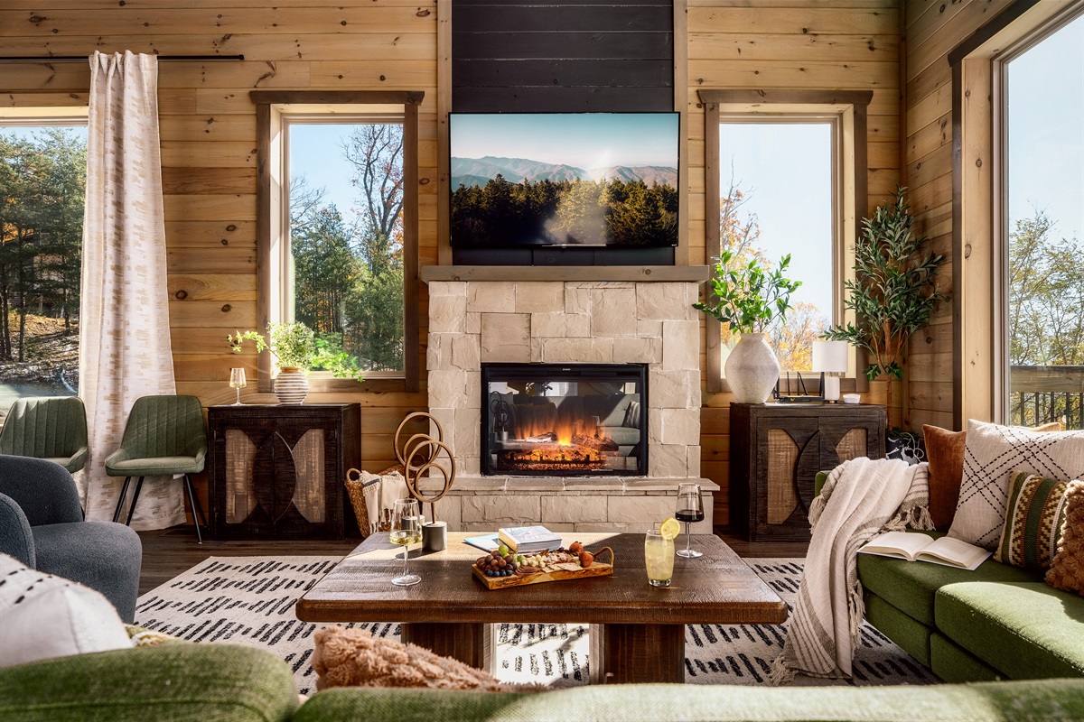 Cozy up by the fireplace. The heart of the living room on chilly cabin nights.