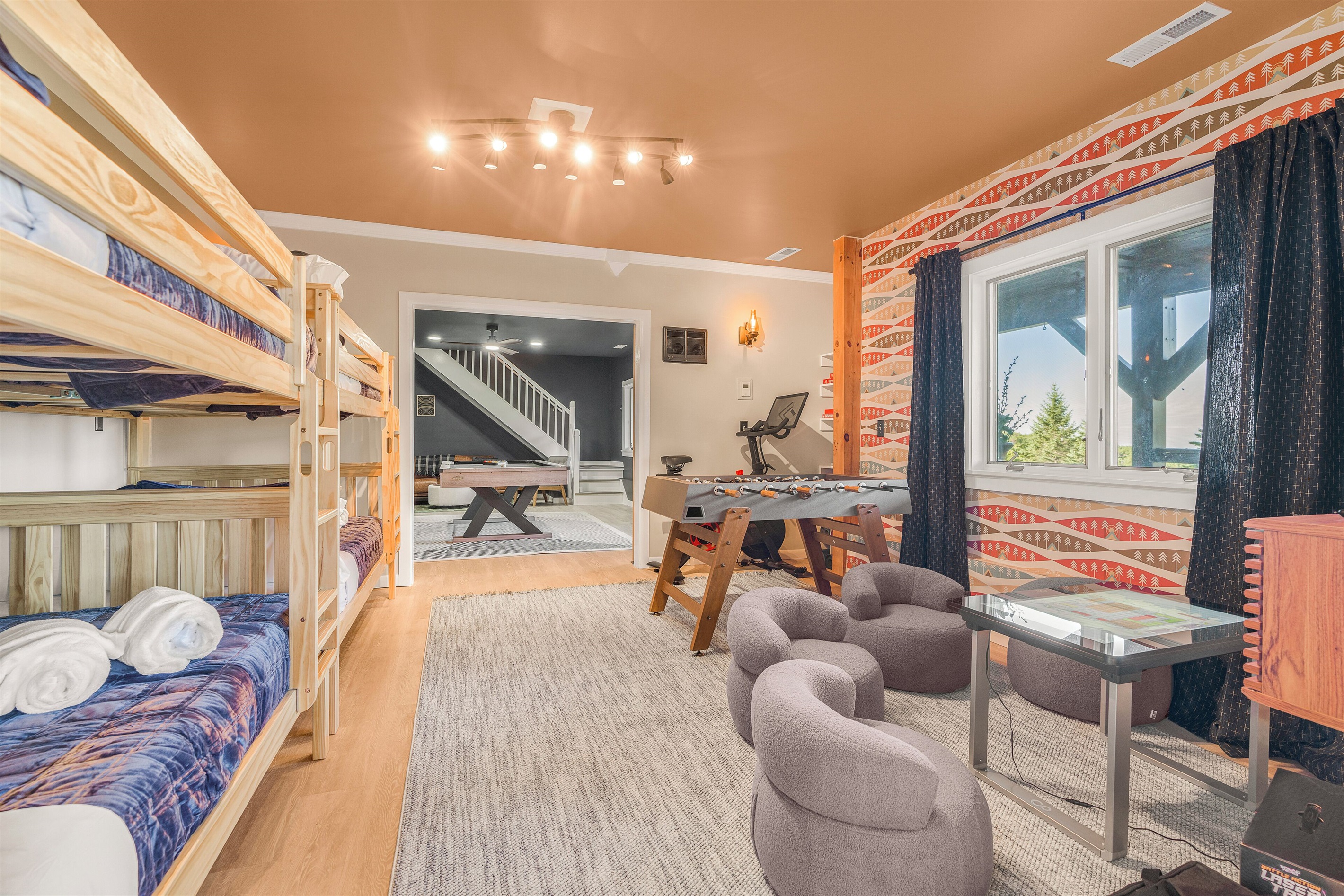 BR5: Two sets of queen-over-queen bunk beds, plus foosball, infinity game table