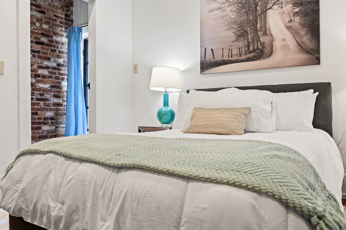 Get a good night's rest in this comfy full-sized bed with plenty of pillows in the Photographer's Suite.