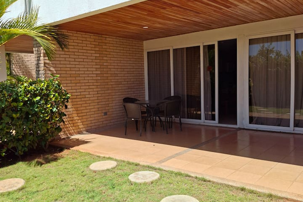 Step outside to a peaceful garden area, perfect for sharing with your family.
