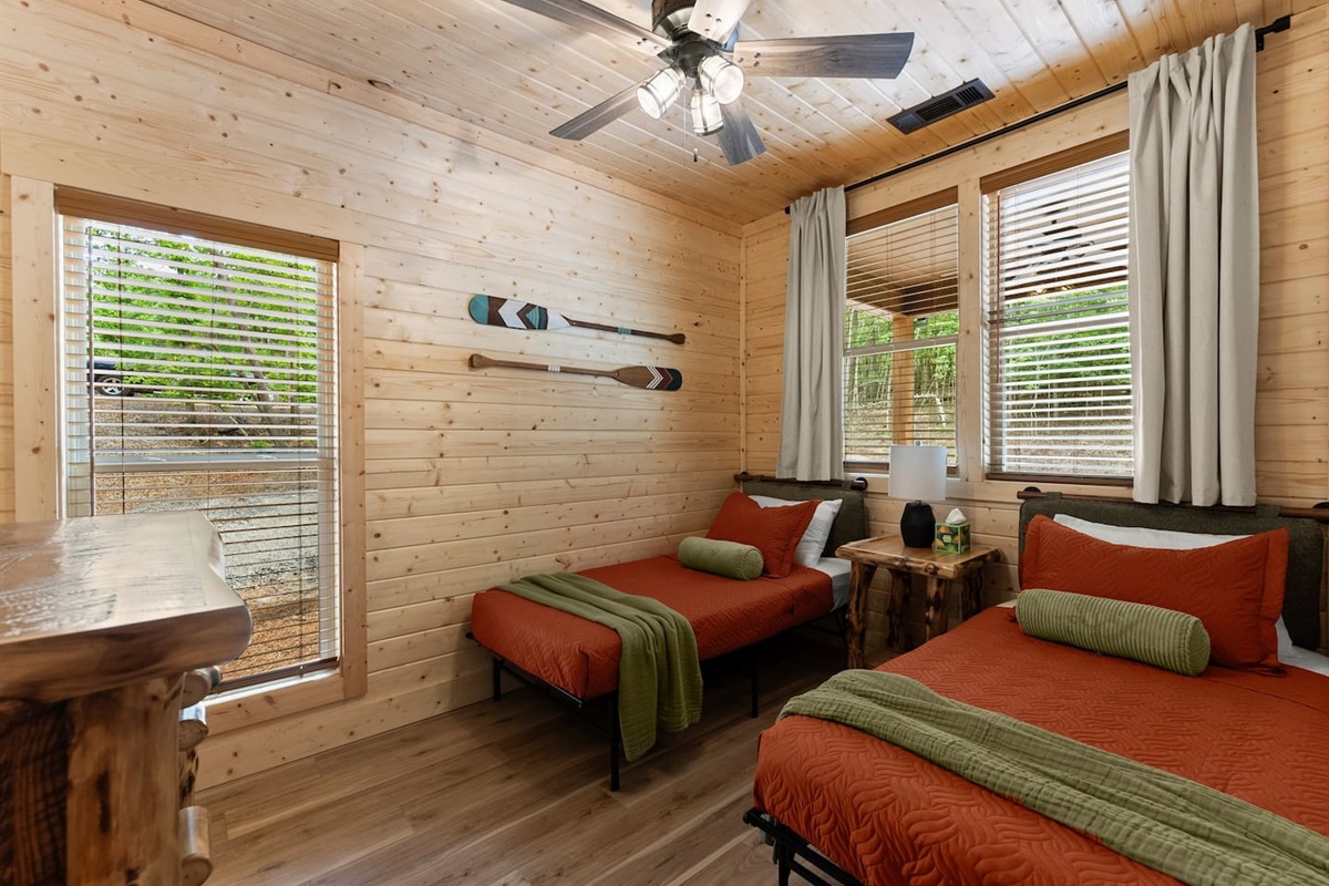 Bright bedroom with two comfy twin beds 