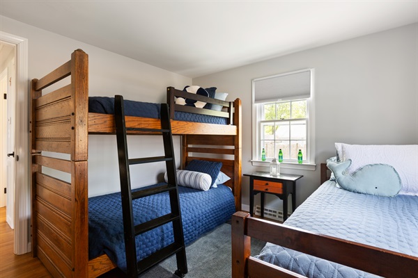 Our second bedroom offers cozy sleeping with a twin bed and a twin bunk bed!