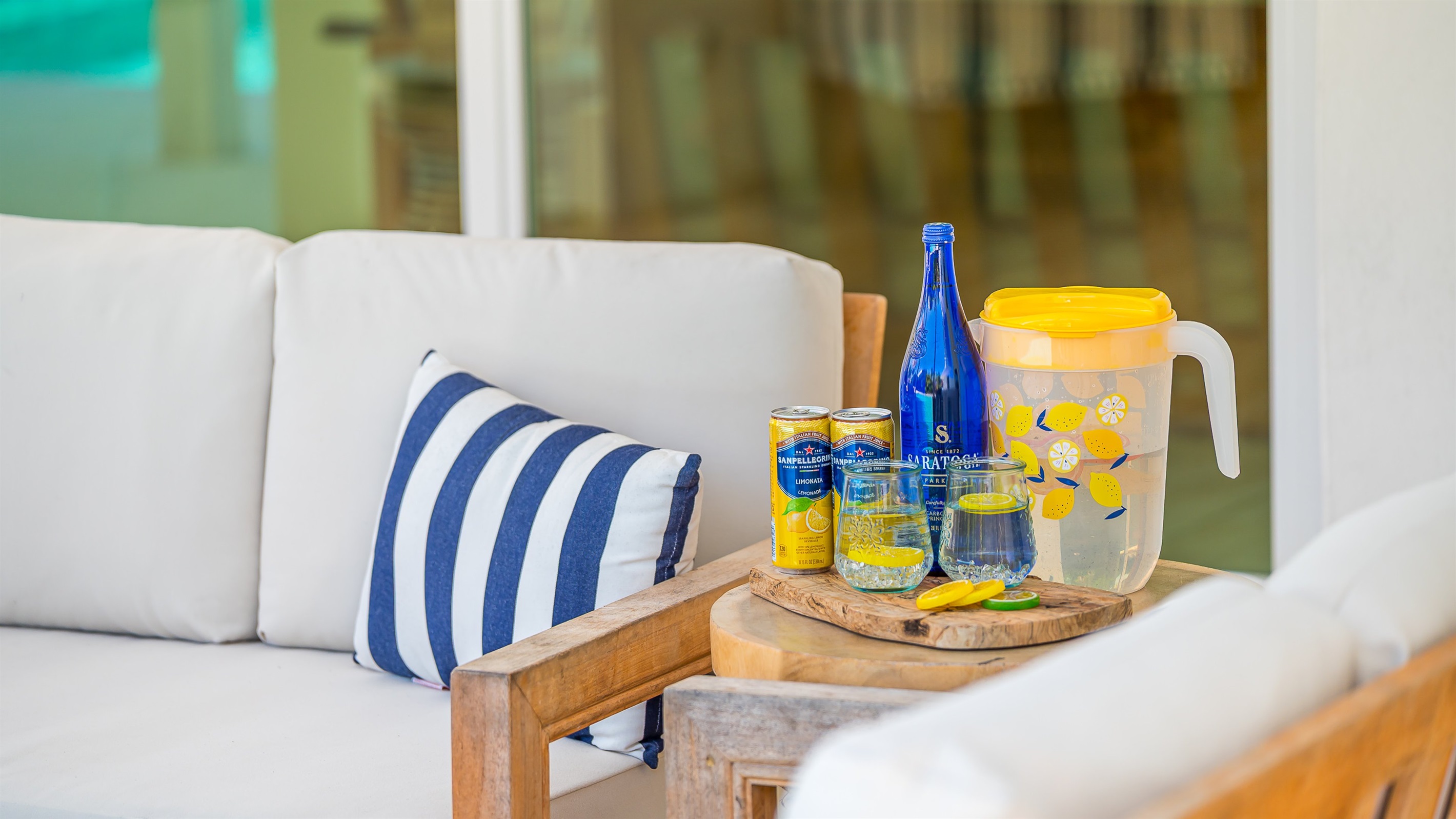 The pool deck is finished in shell white limestone, offering a beautiful natural backdrop.  By night, enjoy the tiki bar, TV, fire table, and the glow of the Jupiter Lighthouse Beacon 