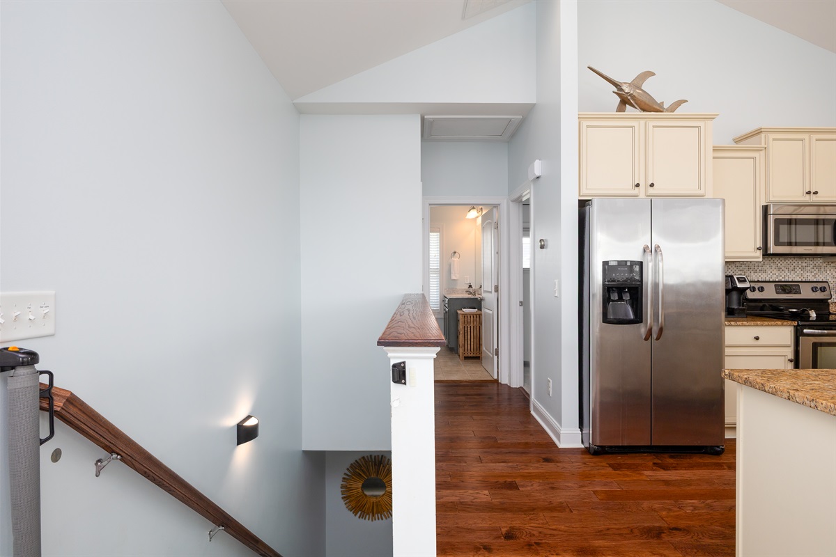 The open layout connects the stairway to the kitchen