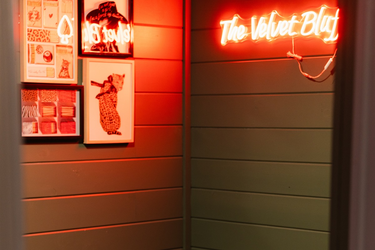 This neon-lit corner adds a unique touch to the home.