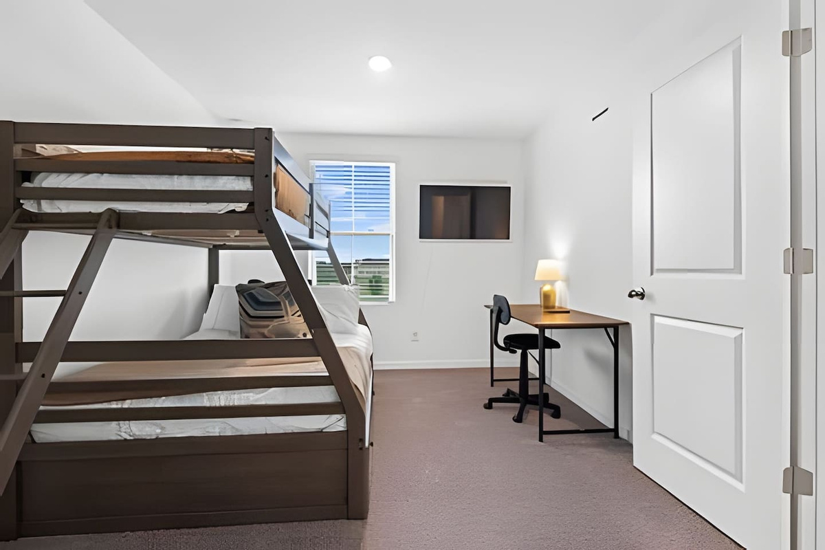 Family Room: Twin-over-full bunk bed with extra drawer storage & a desk for work/study. 

