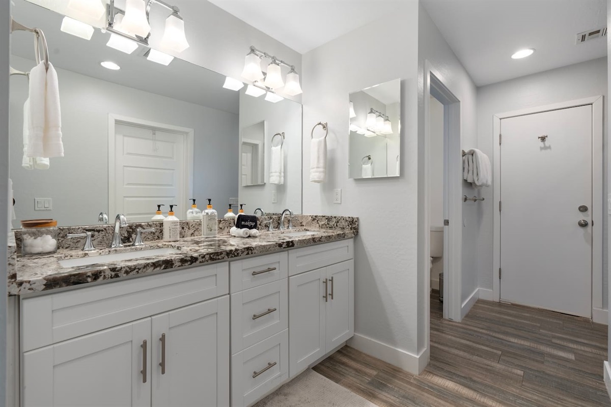 Spacious bathroom featuring a large sink, providing ample counter space for convenience and organization.
