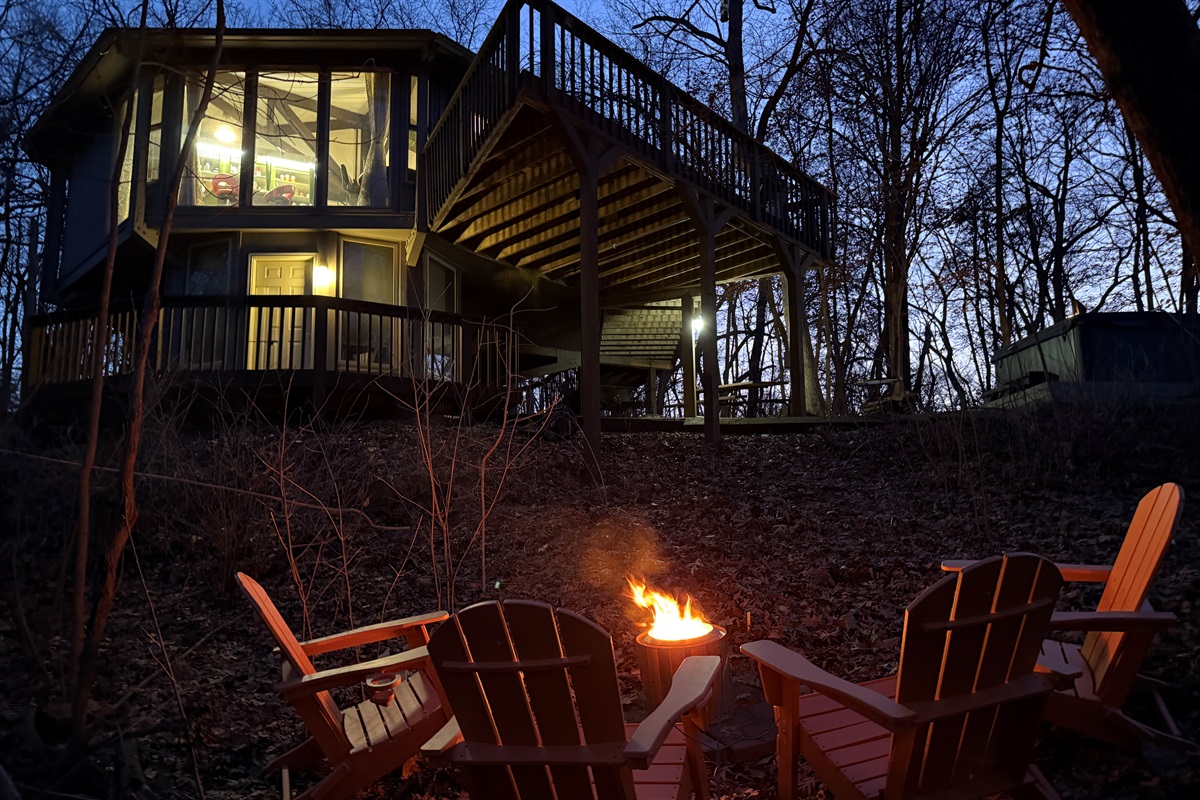 Enjoy a nice fire in the woods, appreciate the unique octagon shape of the house!