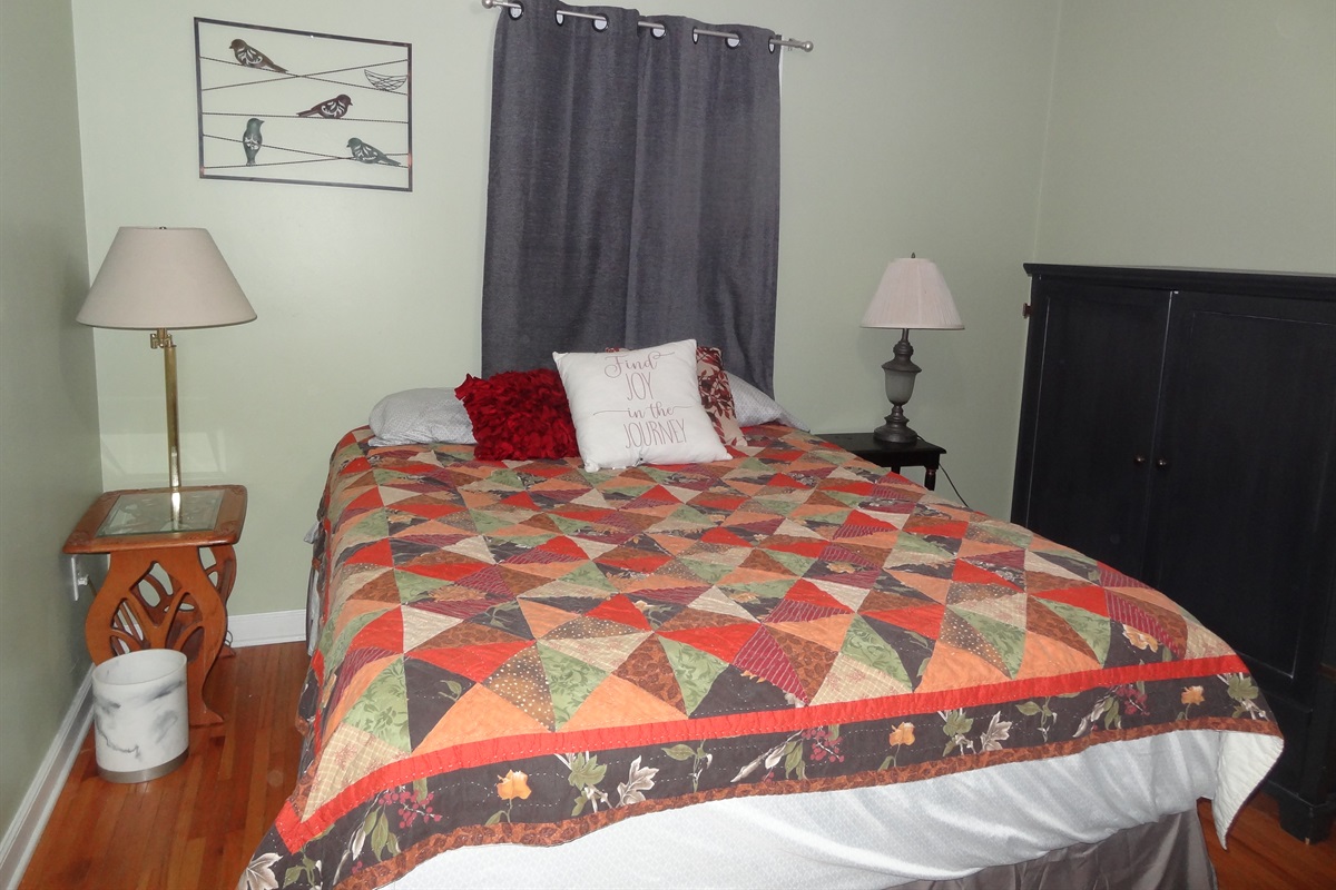 2nd bedroom with queen bed and Roku smart TV