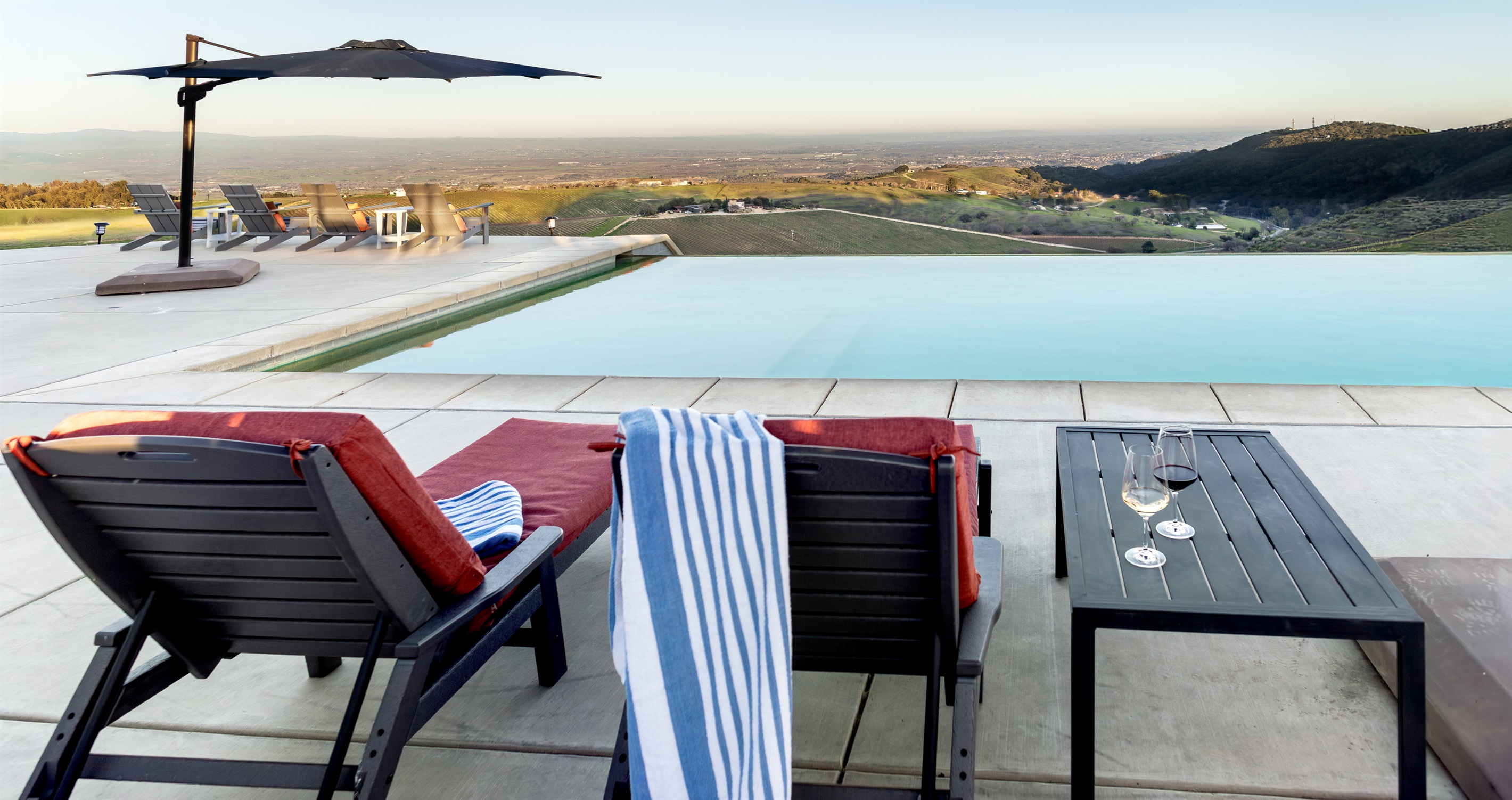 Loungers, wine glasses, and a view that stretches all the way to the horizon. This is what a Paso Robles afternoon looks like from the top.