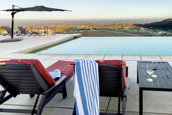 Loungers, wine glasses, and a view that stretches all the way to the horizon. This is what a Paso Robles afternoon looks like from the top.