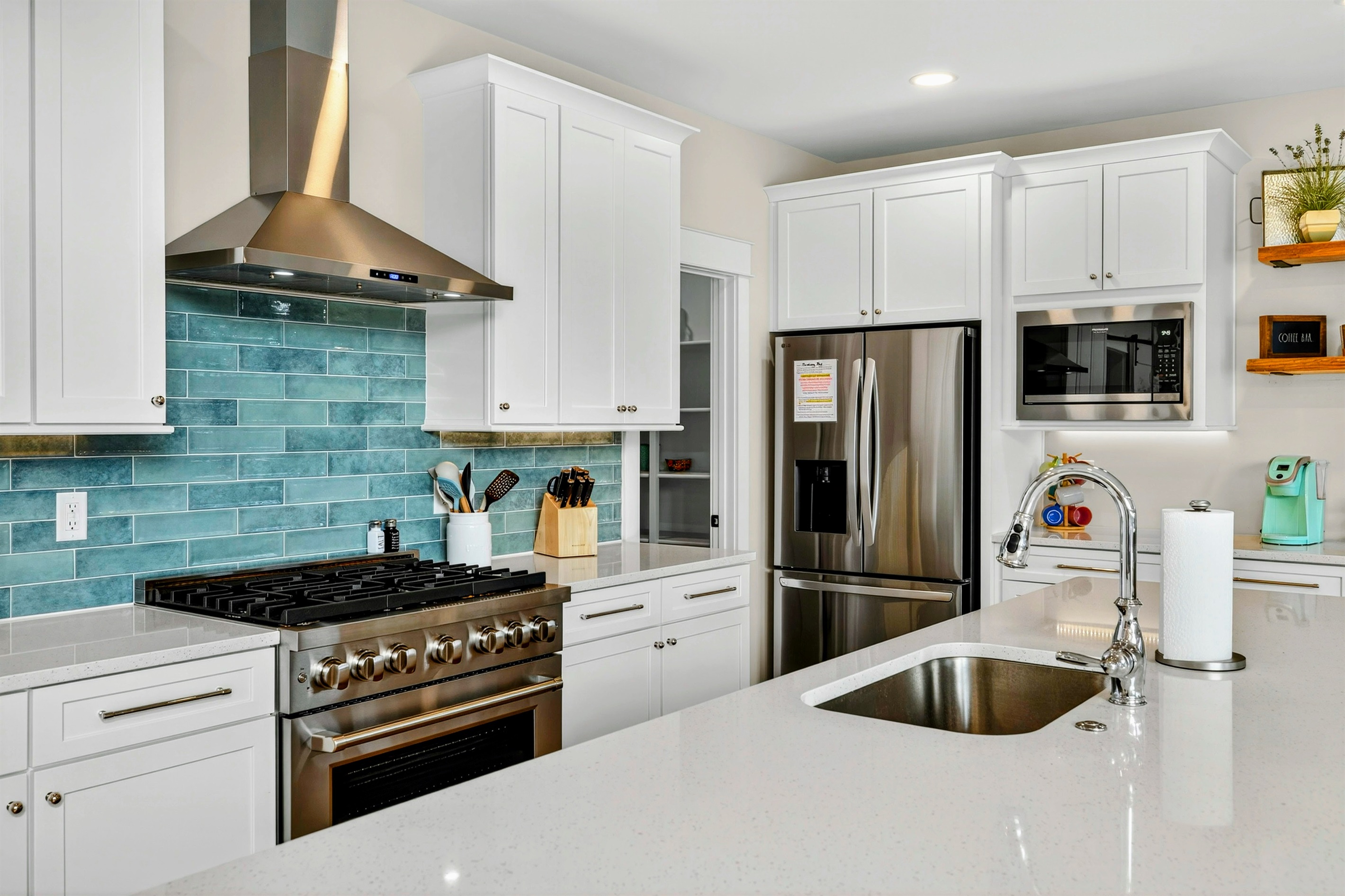Our teal backsplash is a showstopper and the showpiece of the kitchen. Fun Fact:We loved this teal backsplash so much in the design showroom that it has set the tone for the entire color pallet inspiring the colors that flow throughout Blueberry Bay!