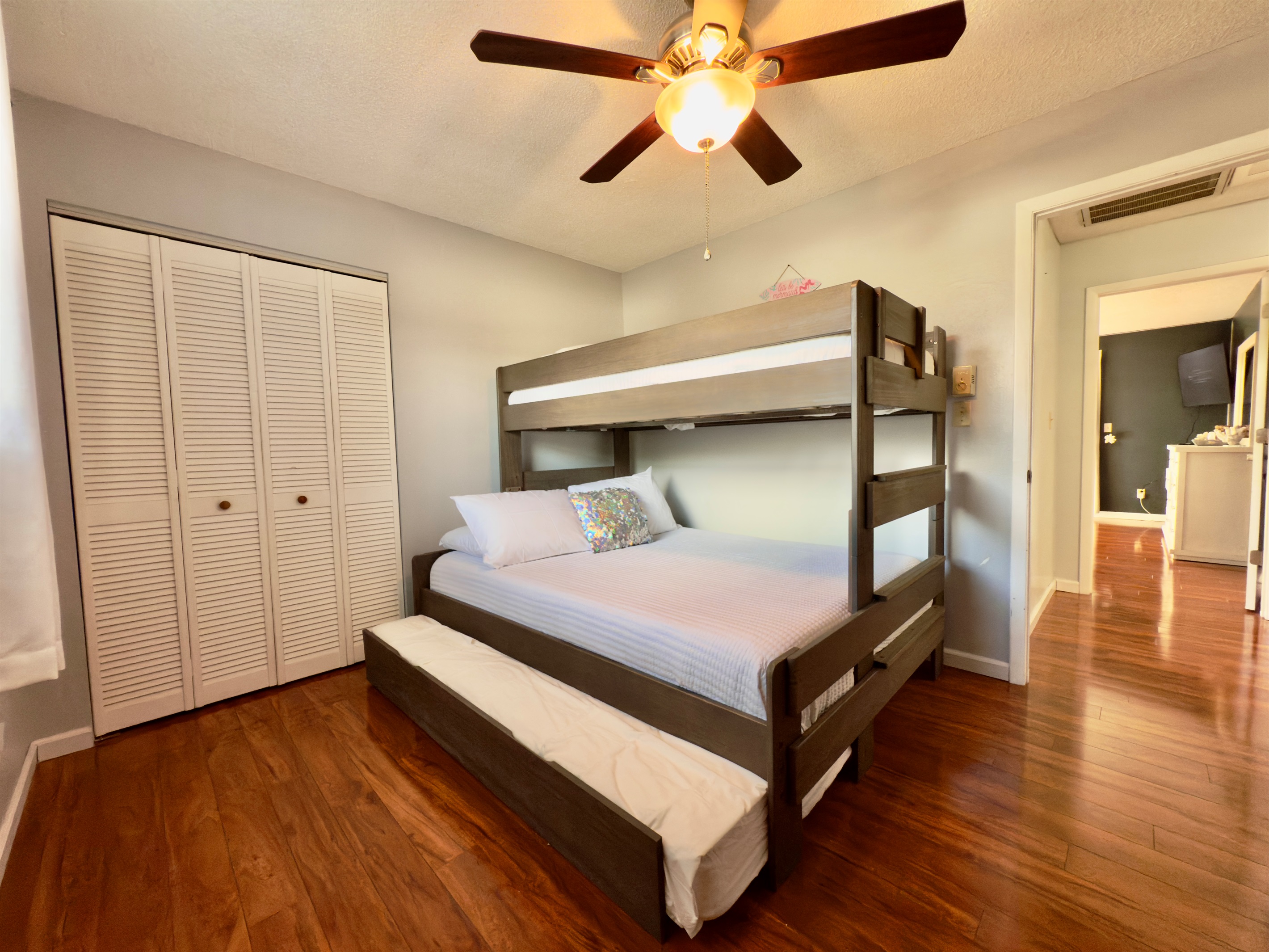 Twin XL over Queen bunk with Twin XL trundle — ideal for a small family or kids sharing a room.