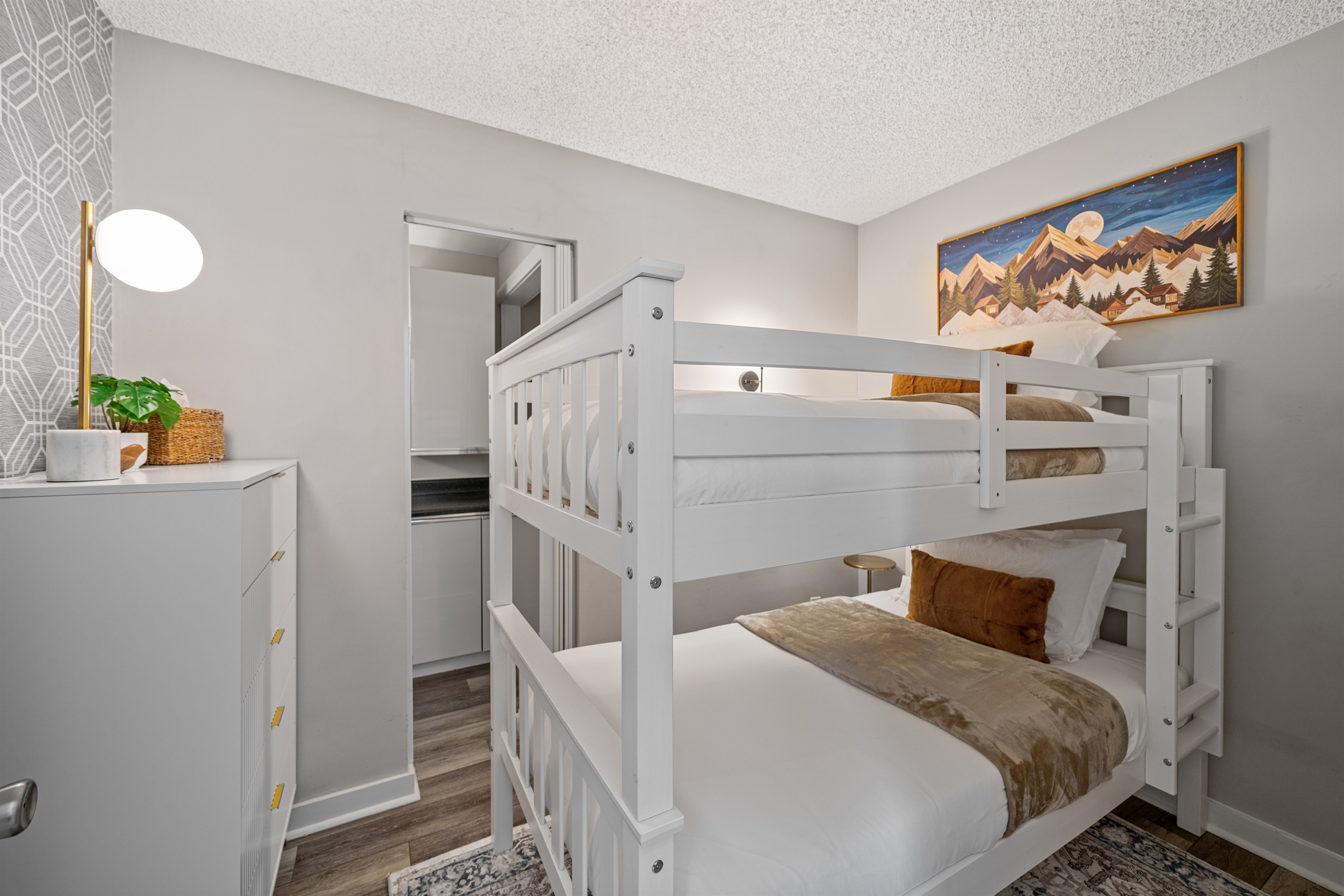 Twin bunk beds with attached full bathroom