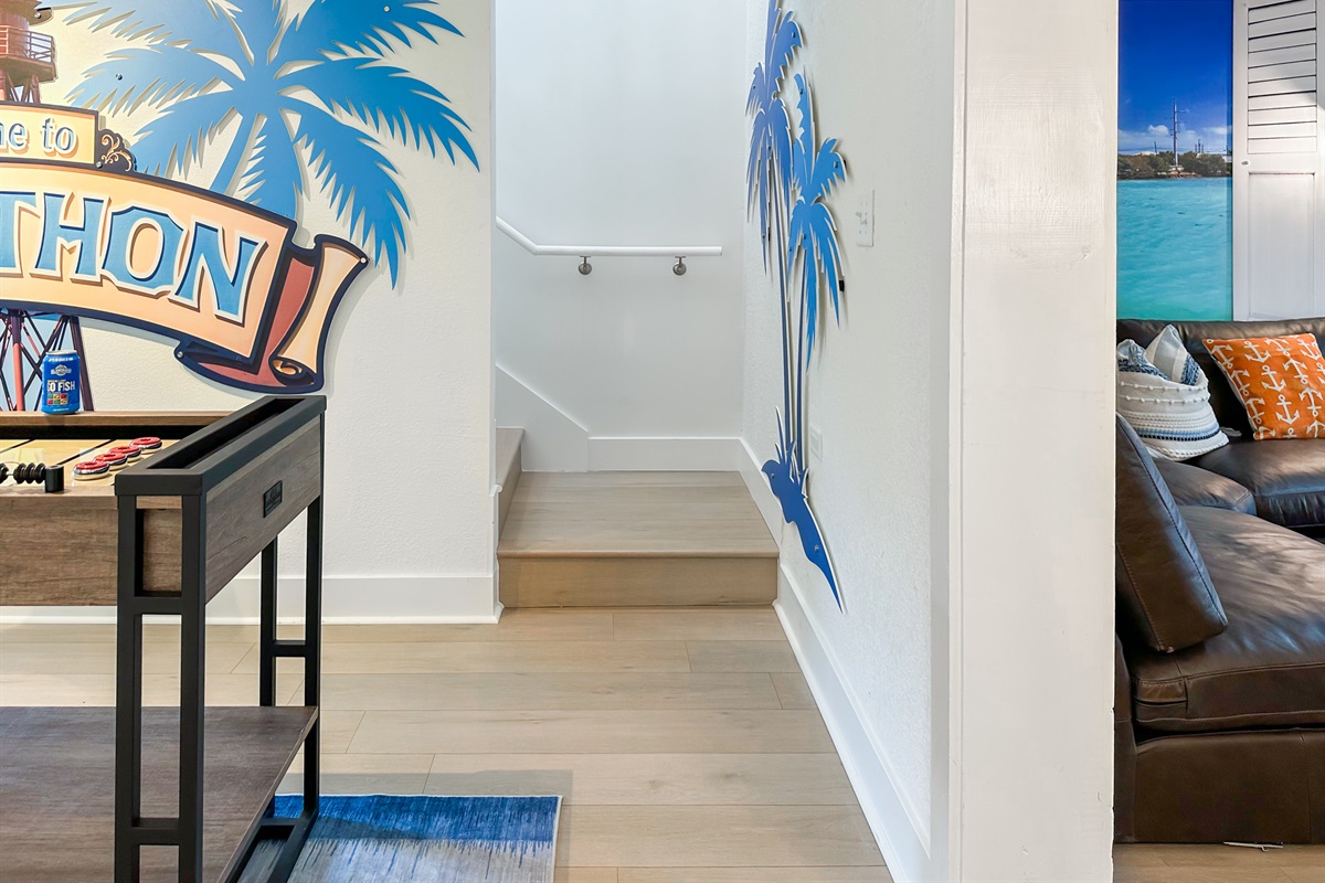 Upstairs access is between the game room and the living room.