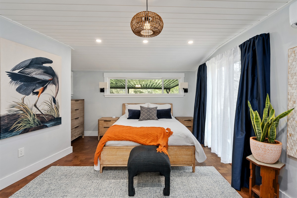 A calm and private retreat with rich redwood floors and soft, layered bedding, designed for deep, restorative sleep after long hospital shifts.