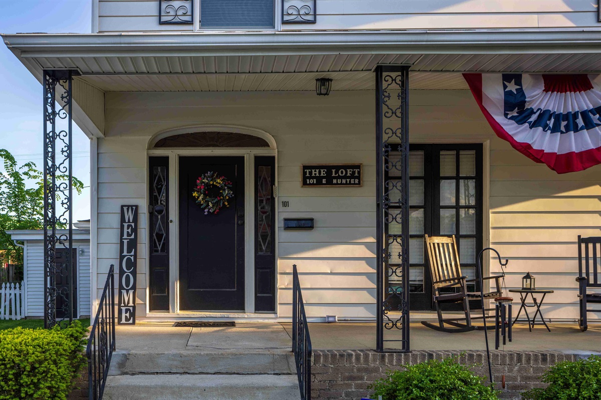 The porch is raised up a couple of steps. 