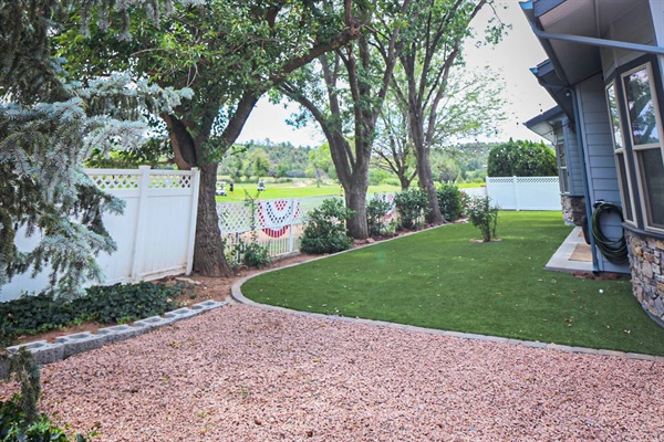 Soak in mountain air from the expansive back yard facing the golf course with mature trees and view of Payson Golf Course