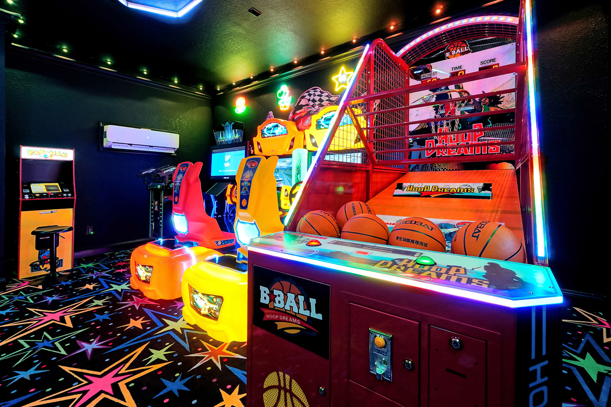 Arcade game room with basketball arcade