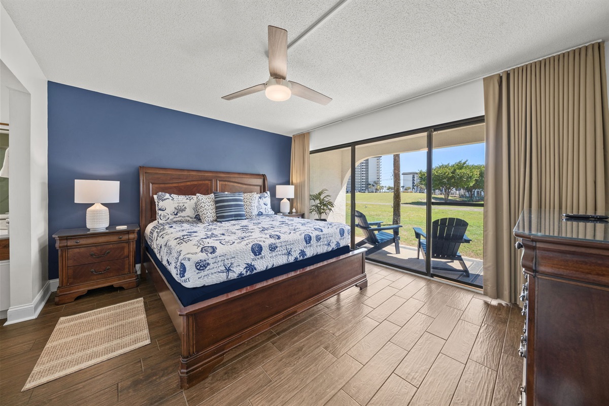 Spacious Master King Suite with sliding glass doors overlooking patio