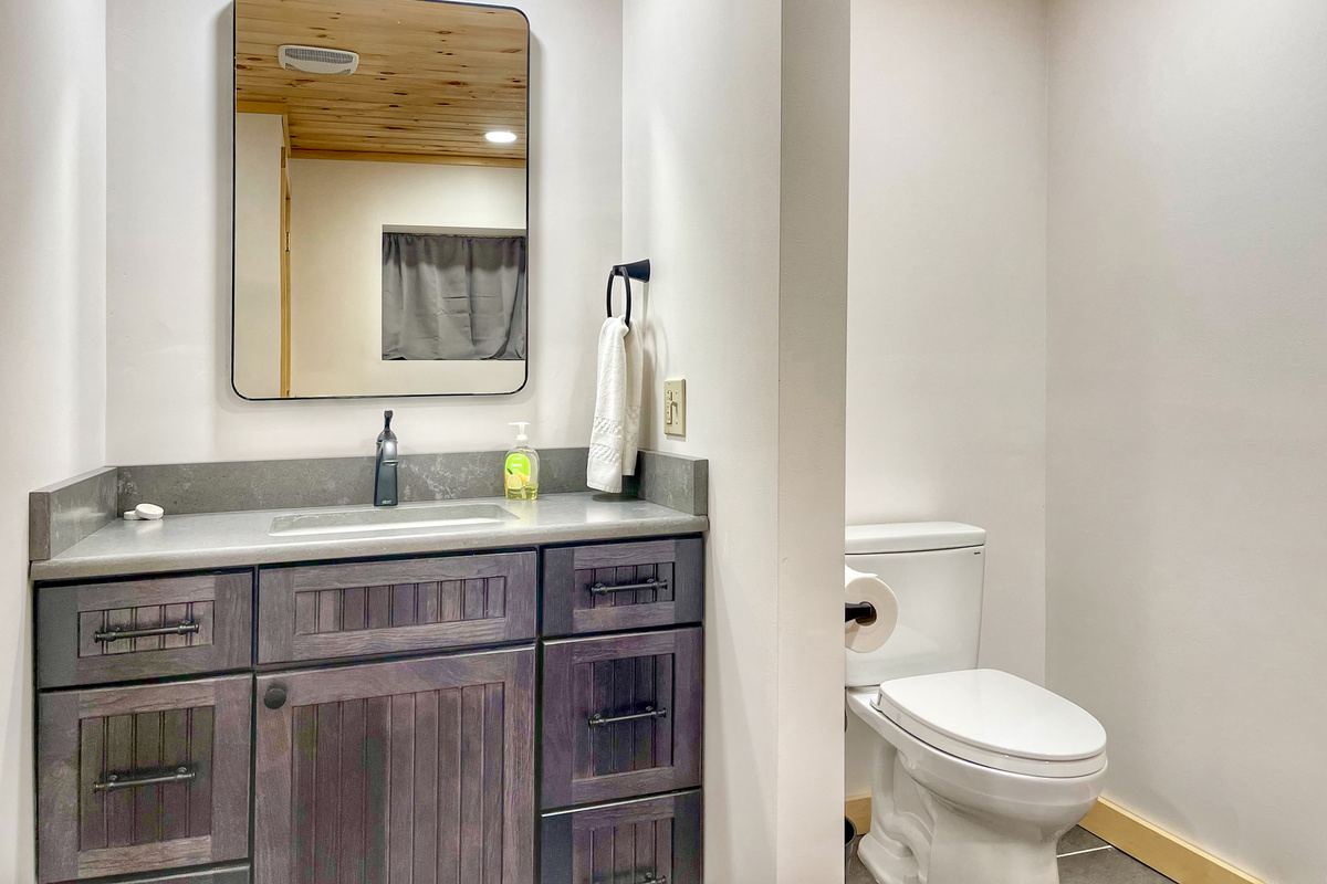 Ensuite bathroom 3 is spacious, modern, and immaculate. Store your belongings in the stylish vanity. 