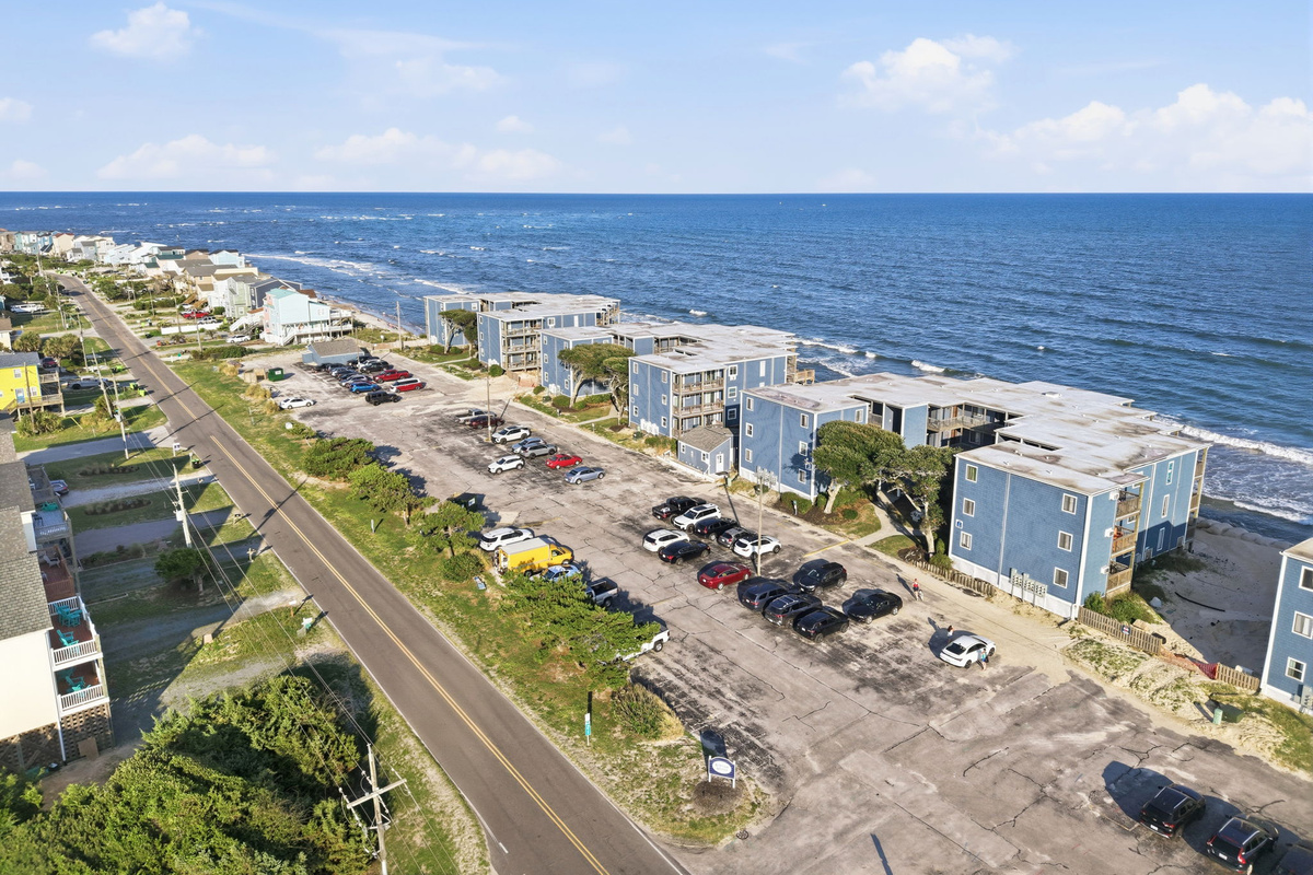 A sweeping coastal perspective of Topsail Reef, capturing the relaxing island atmosphere, oceanfront buildings, and the natural beauty that makes this area a favorite getaway destination
