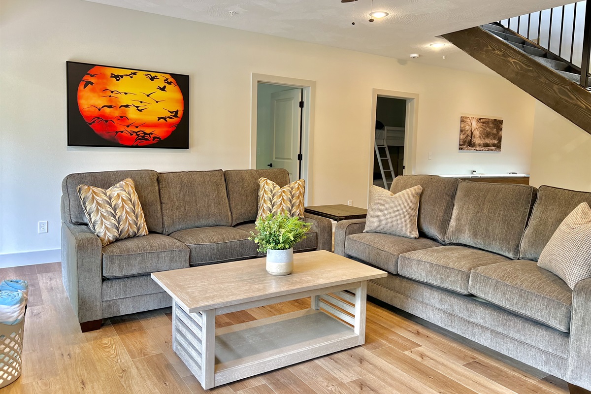 Living room with patio access to the grill, hot tub, and fire pit!