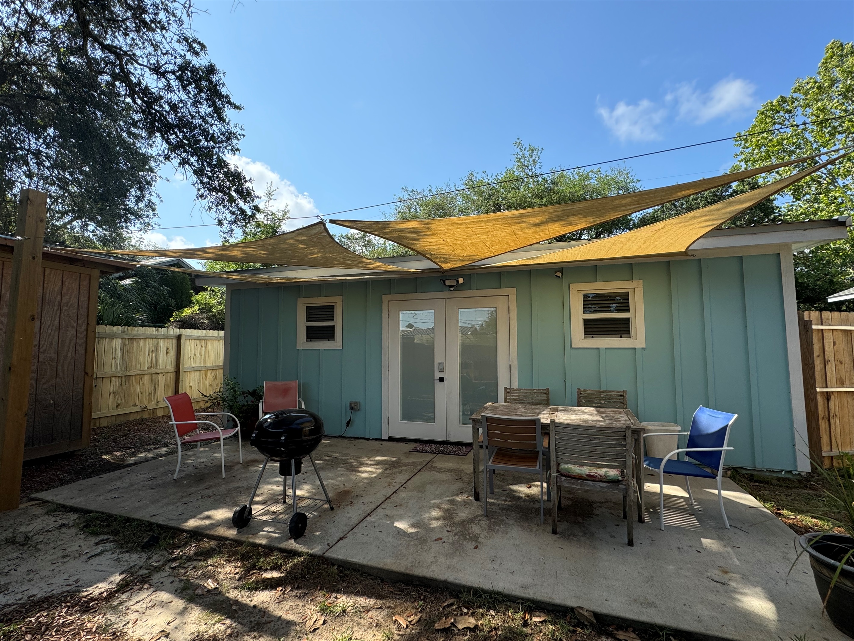 Back patio area with table and grill