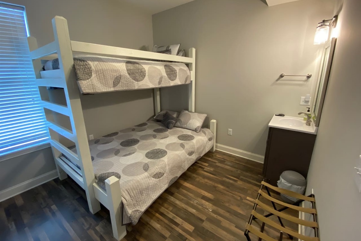 Bedroom off of kid room with full/queen bottom and twin top.