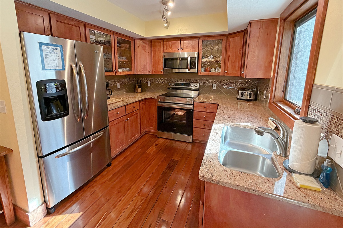 Kitchen with new appliances and view to hot tub.