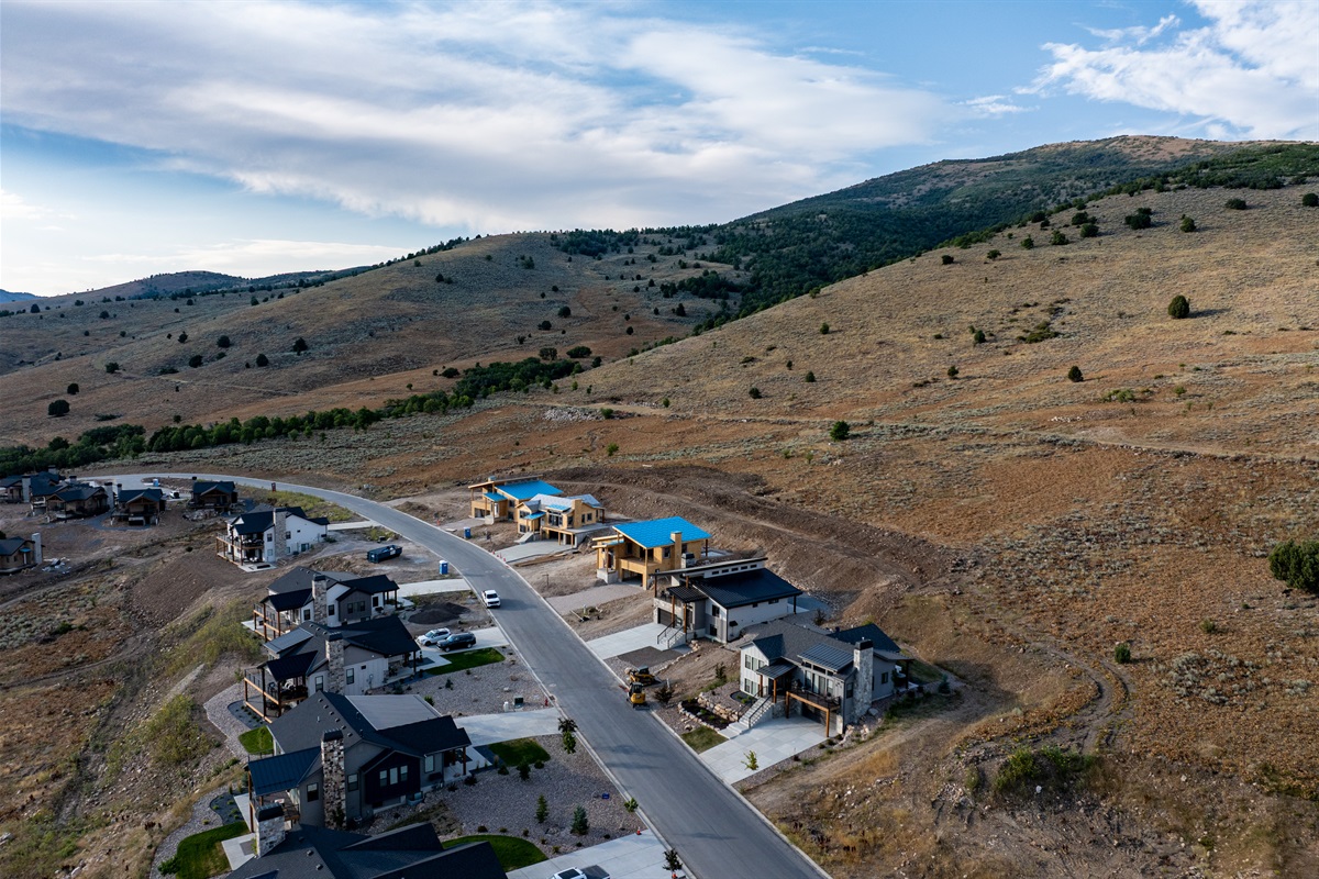 Additional drone views of The Bridges development, capturing the sweeping landscape.