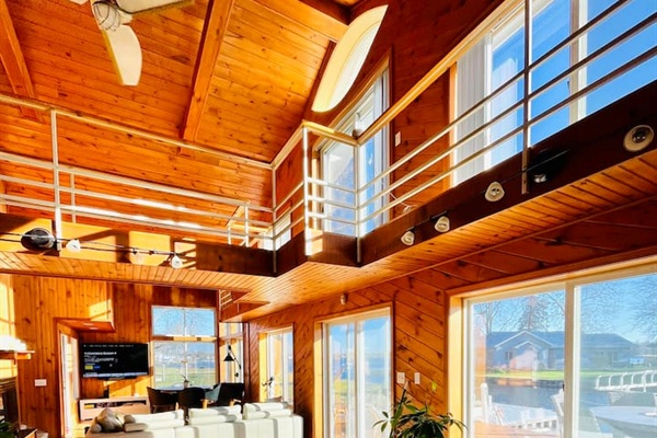 Stunning vaulted ceilings and large windows overlooking the water.
