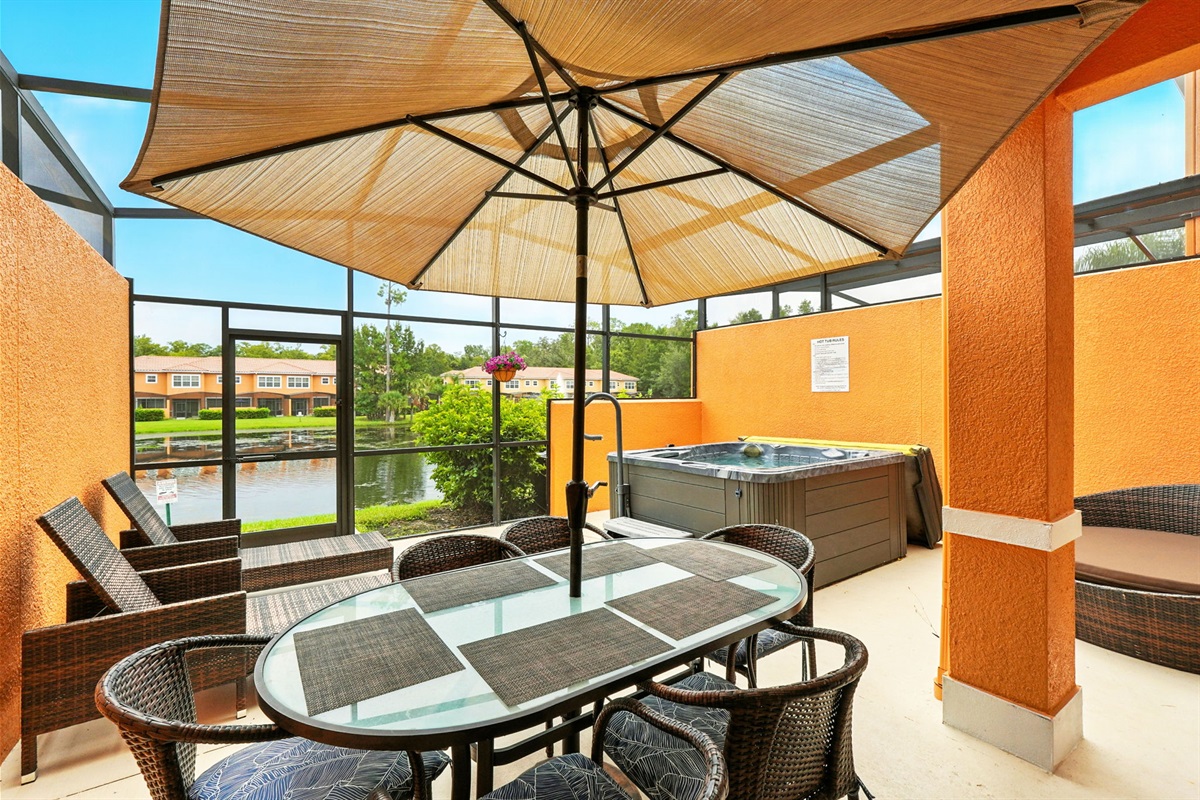 Private lanai with dining area and hot tub