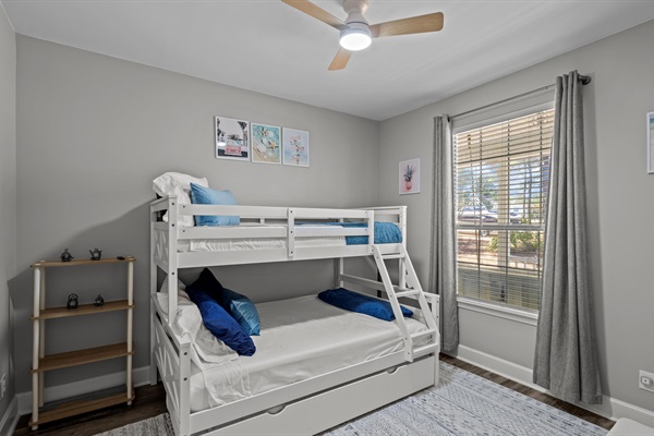 The ultimate kids' hangout- twin-over-full bunk with a trundle and a chair that converts to another twin!