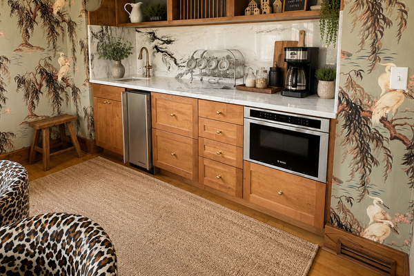 Part of the dining room gathering space, this convenient beverage station features a pebble ice maker, microwave, refrigerator and freezer drawers, coffee station, and extra prep space. Perfect for drinks, snacks, and keeping groups comfortably supplied.