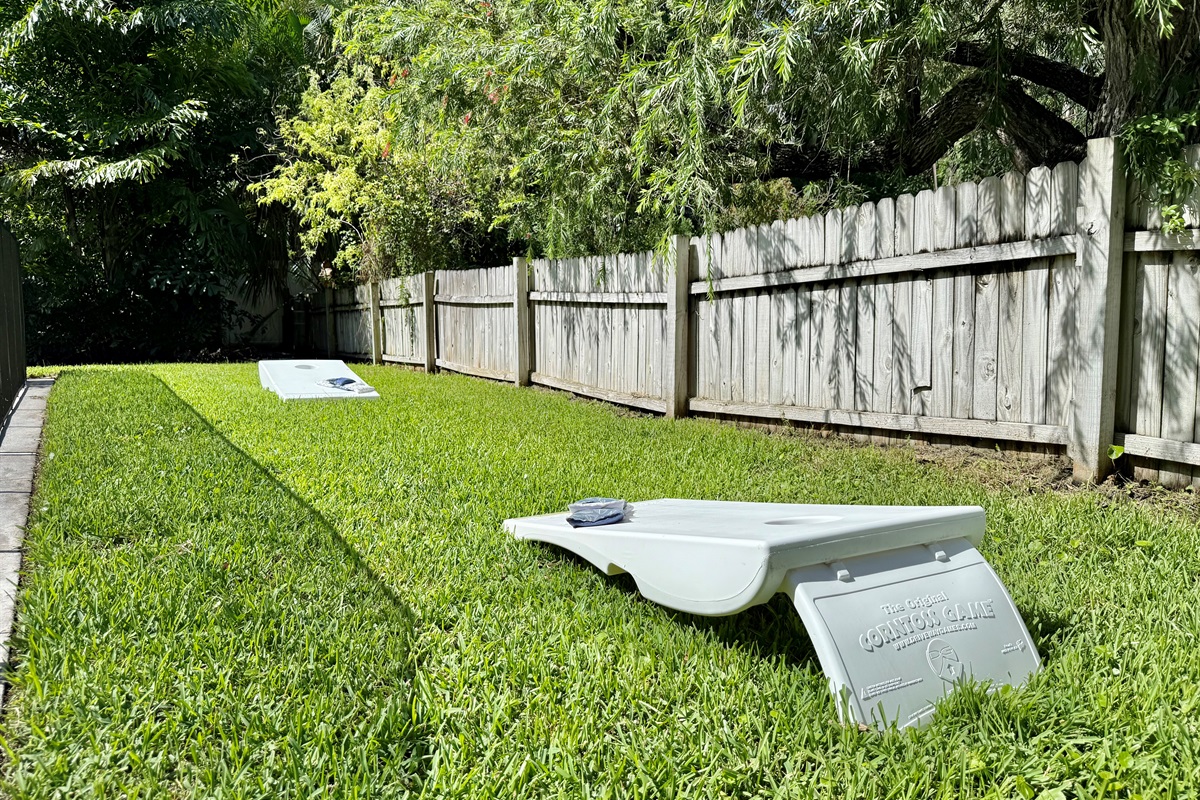 Cornhole tournaments by day, stargazing by night — this yard has it all.